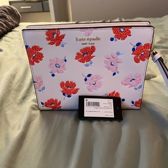 Morgan Dotty Floral Embossed Gusseted
Wristlet Kate spade SOLD OUT!! New w tags - Picture 5 of 6